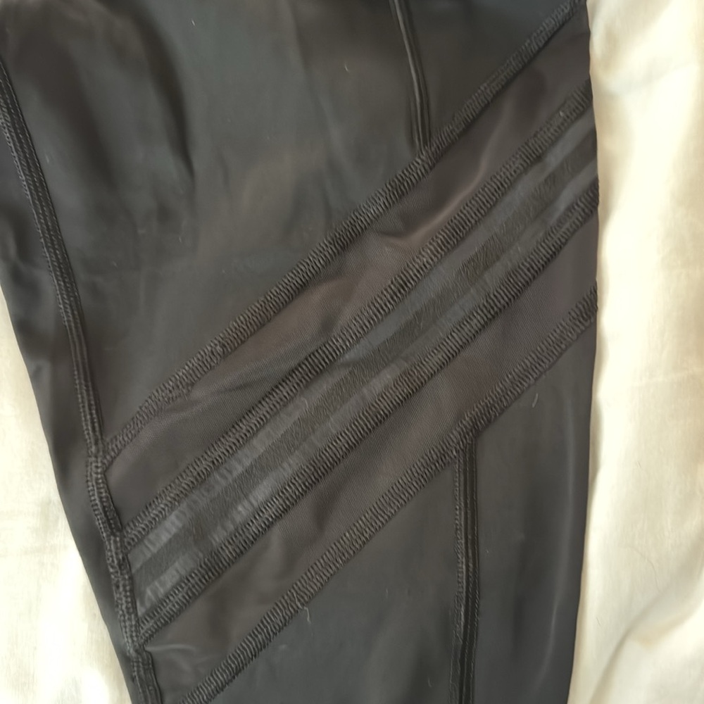 Athleta Black Leggings Size Small 7/8 length with mesh stripes, pockets
